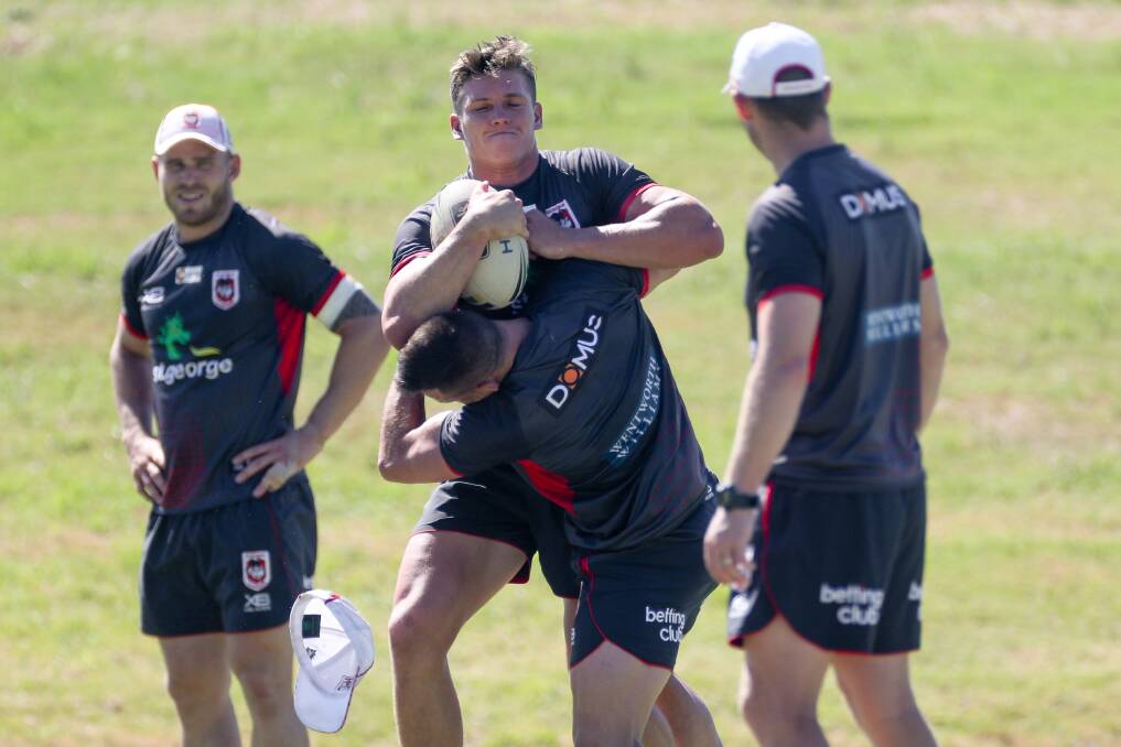 Reuben Garrick (with the ball) trains with the Dragons in the pre-season. Photo: ADAM McLEAN