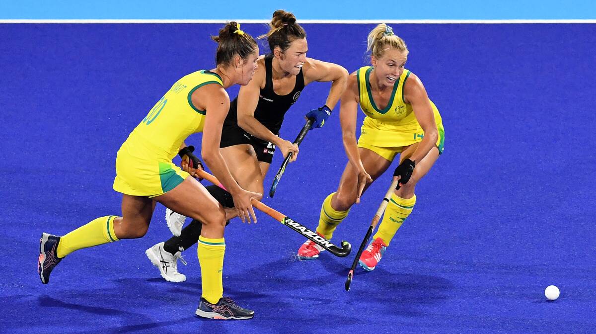 Grace Stewart (left) attempts to win possession against New Zealand. Photo: DAN PELED
