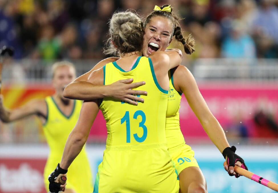 Grace Stewart celebrates a goal with her teammate Edwina Bone. Photo: HOCKEY AUSTRALIA