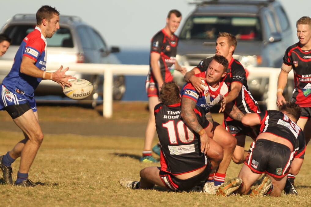 Lions' Kal Collins gets a pass away despite pressure from the Knights. Photo: DAVID HALL