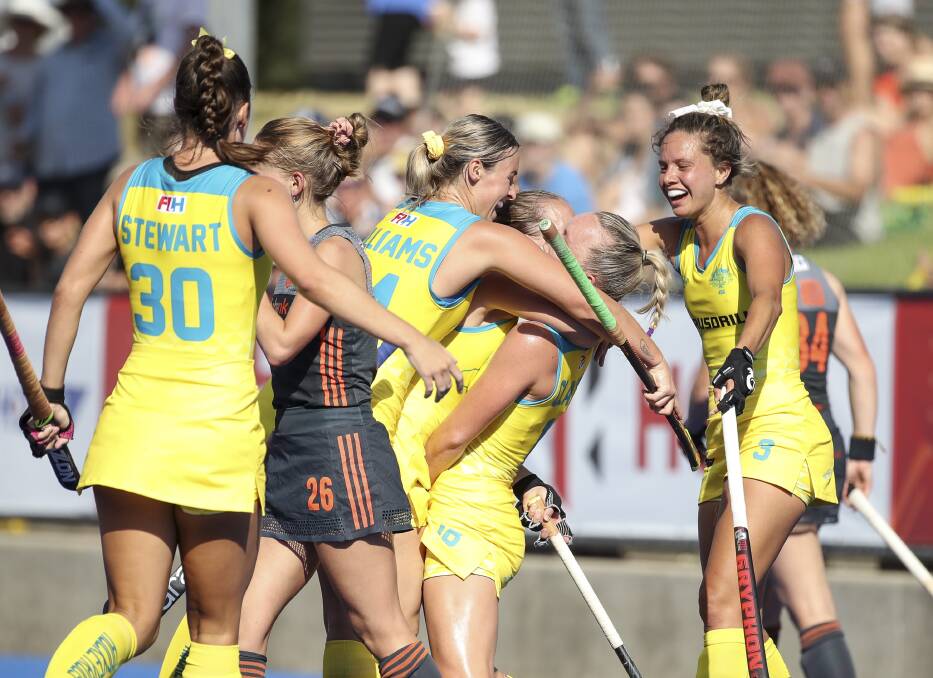 Grace Stewart (30) and her Hockeyroos celebrate a goal against the Netherlands. Photo: Grant Treeby/HA