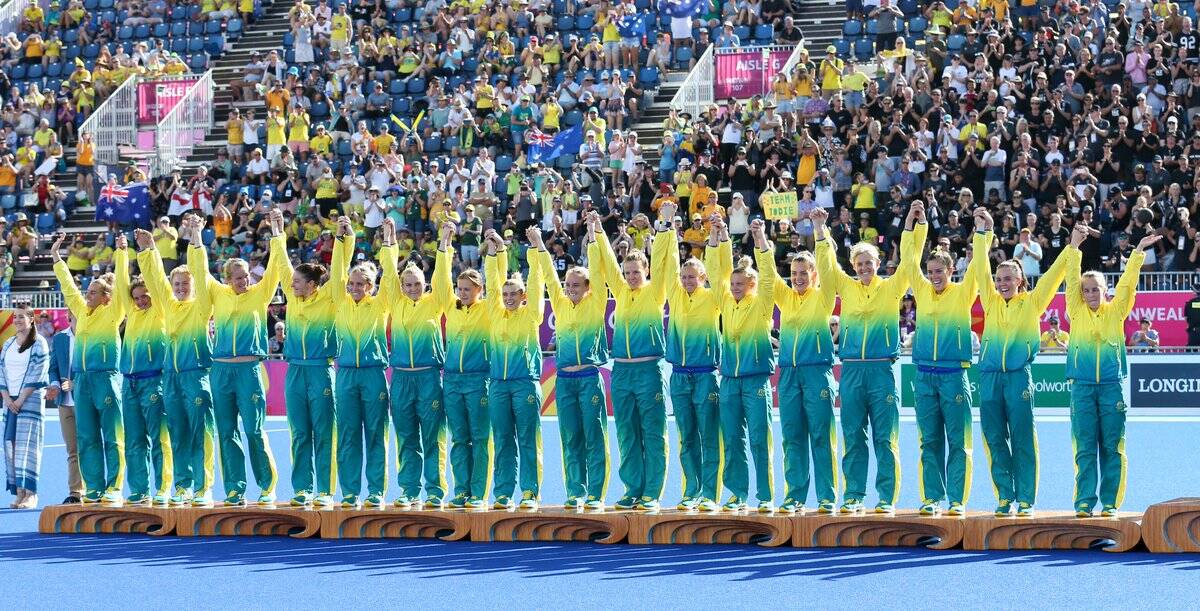 SILVER LINING: Grace Stewart (third from right) and her Hockeyroos team after the medal presentation. Photo: GRANT TREEBY