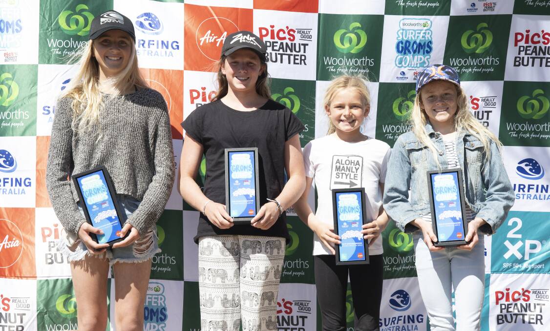 Holly Wishart (second from left) and the other three under 14 girls podium finishers. Photo: ETHAN SMITH/SURFING NSW