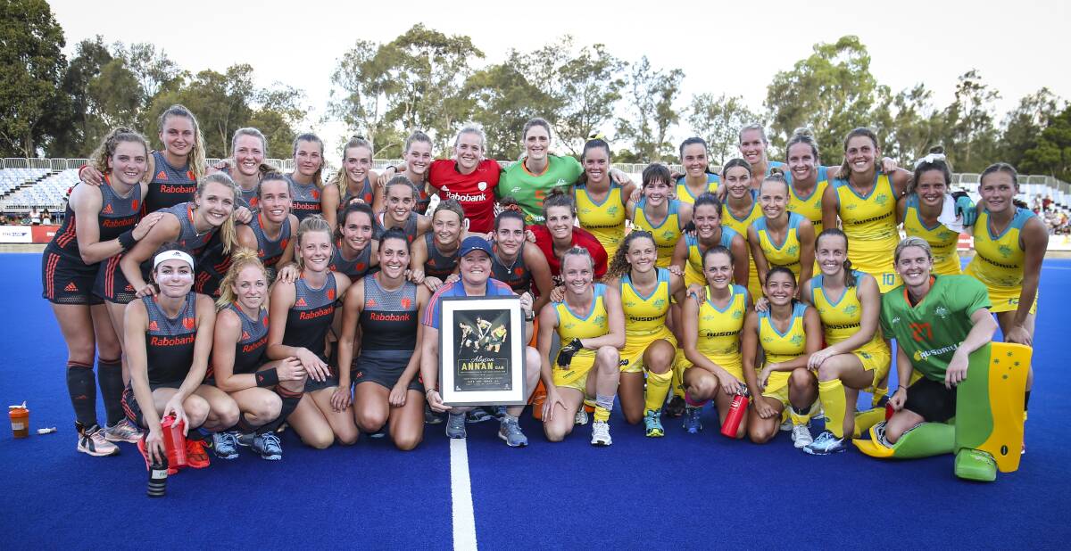The Hockeyroos and Netherlands after their match on Saturday. Photo: Grant Treeby/HA