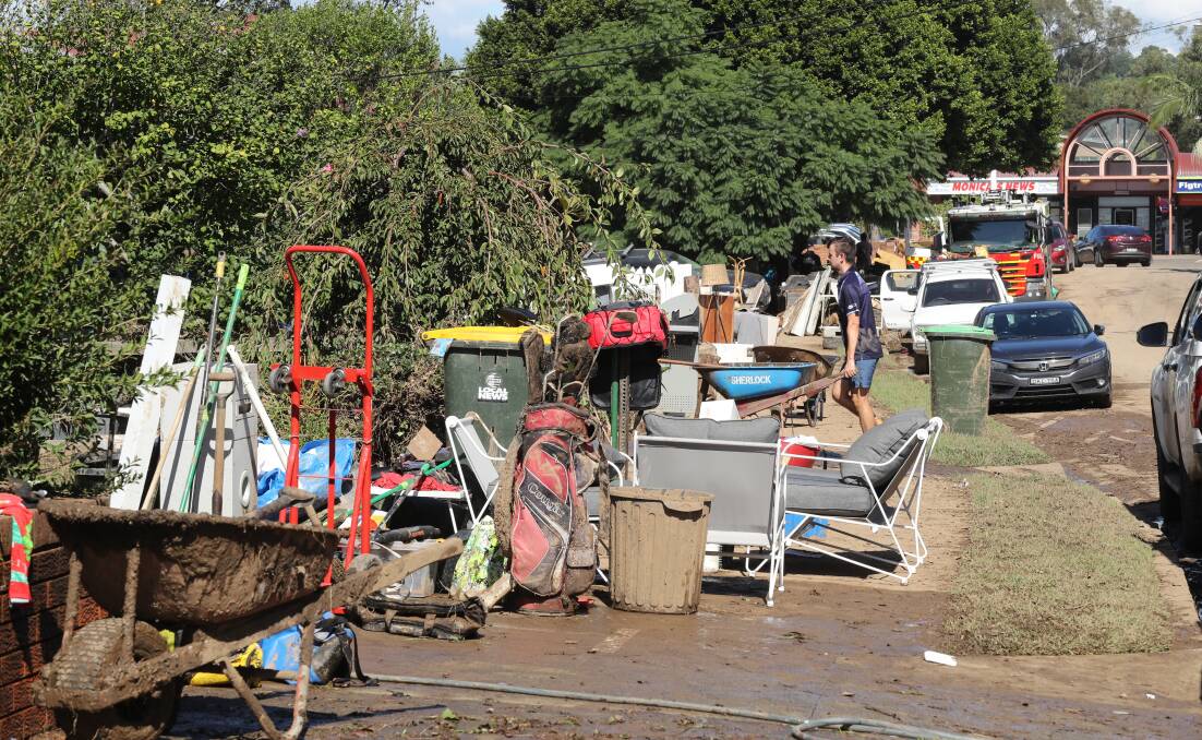 One resident of Arrow Avenue in Figtree said it was looking like a "war zone" after it flooded on Saturday morning. Picture by Robert Peet