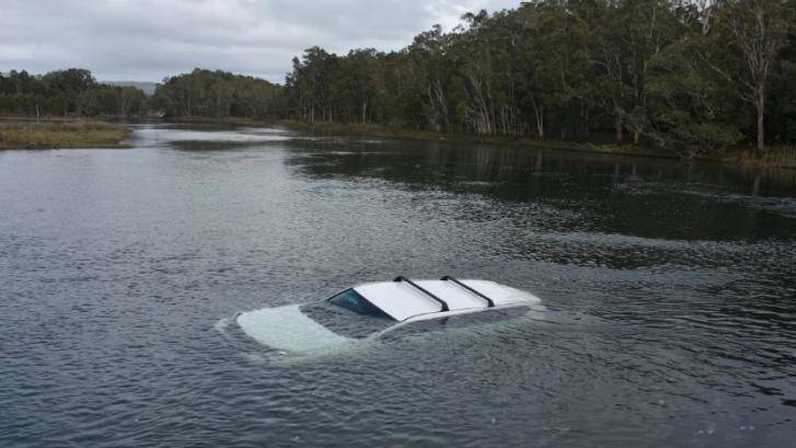The driver was lucky to escape after he drove into a NSW Mid-North Coast lake lake after being scared by a spider. For the full story, hit the image above.