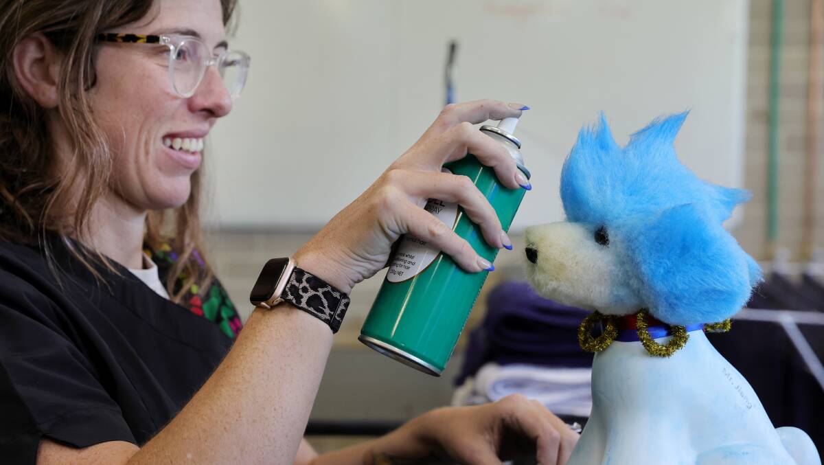 Sam Kalinic puts the finishing touches to her model dog. Picture by Sylvia Liber