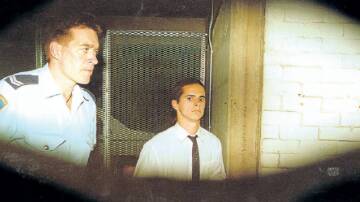 A baby-faced Matthew De Gruchy pictured leaving Wollongong killing his mother, brother and sister in 1996.