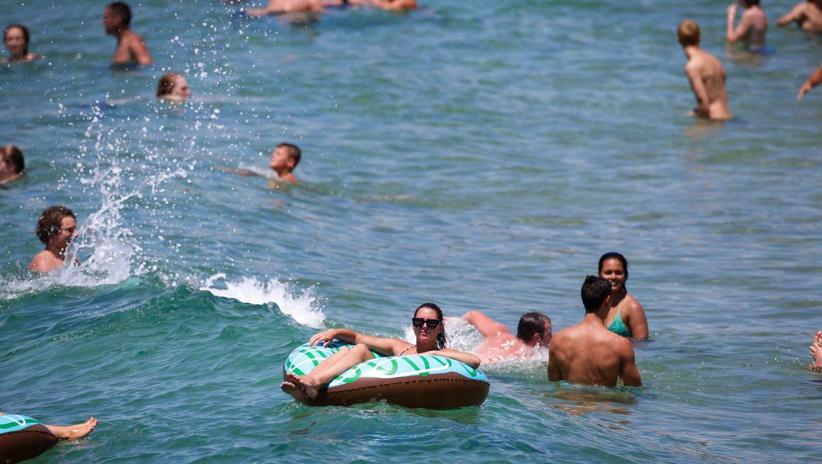 People cooling off at an Illawarra beach. Photo: Adam McLean. 
