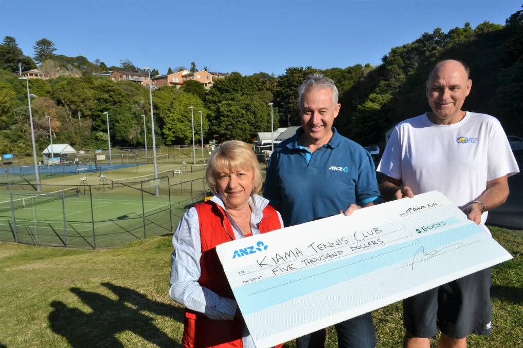 Area ANZ bank coordinator Mark Simpson (centre) presents a $5000 cheque to Kiama Tennis Club president Dave Lehman and board member Jackie Parker at the Kiama courts in August. Picture: Rebecca Fist