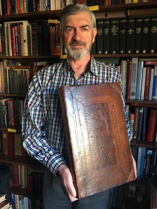 Noel Merrick holding an original issue of Matthew Prior's Poems on Several
Occasions' published in London in 1718 - exactly 300 years ago.