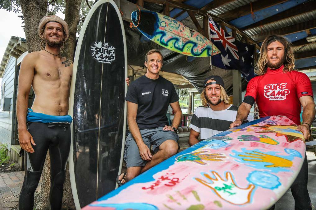 Surf Camp Australia director Guy Olbourne with instructors Shane Sutherland, Sam Douglass and Pascal Hagemeijer in 2015, part of the Saltwater Dreaming Surf Camp that sees Aboriginal kids from Sydney come to Gerroa to learn about indigenous culture and also learn to surf. Picture: Georgia Matts
