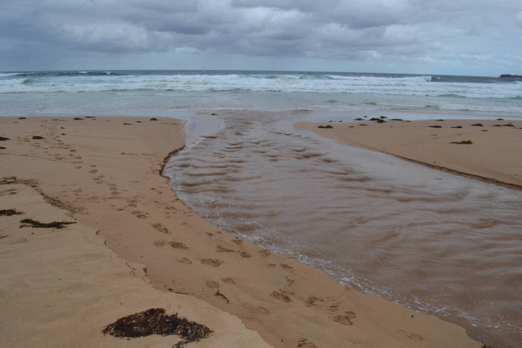 Stormwater being pumped out to sea at Bombo Beach. Picture: Rebecca Fist