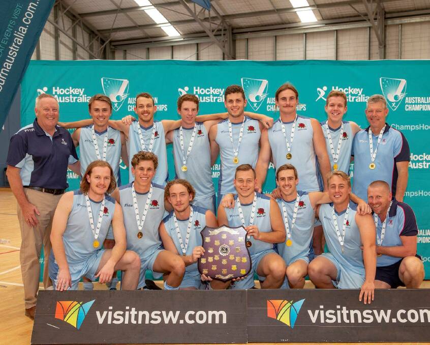 STRONGER AS ONE: The New South Wales under 21 men's side after their grand final win against Queensland. Photo: HOCKEY NSW