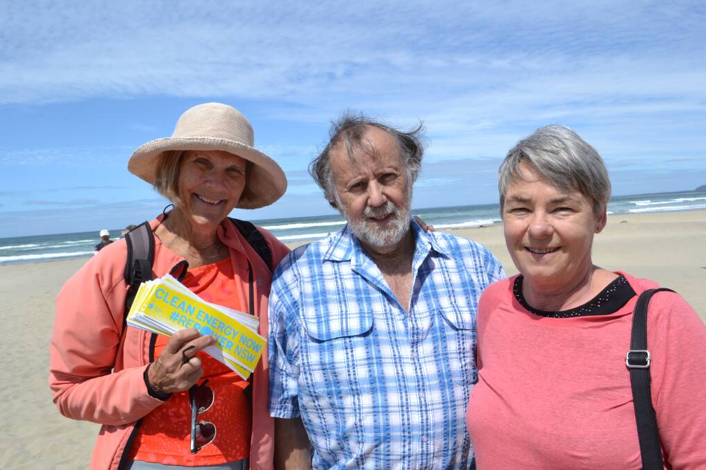 PROTEST: Susan Griffiths from Gerroa, Peter Meaney from Kiama and Kiama councillor Kathy Rice joining dozens at the Stop Adani rally to form a human sign on Seven Mile Beach in 2017. Picture: Rebecca Fist