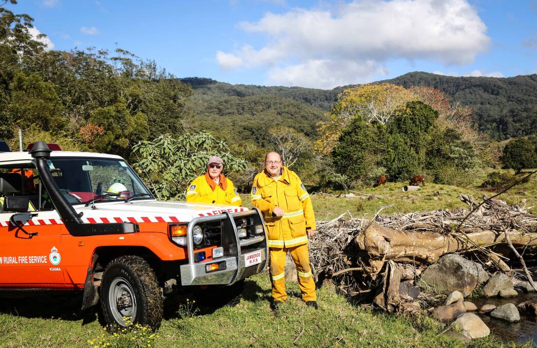 Bob Parker and John Temlett from Jamberoo Rural Fire Service on a Jamberoo property in 2015. Picture: GEORGIA MATTS