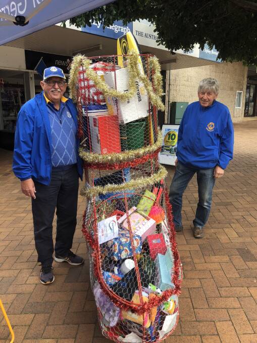 Lions members Mark Westhoff (L) and Karl Kunz (R) with Gerringong Lions Xmas Stocking. Picture: Contributed