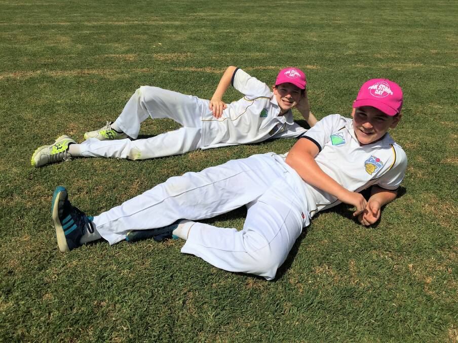 Jarred and Shaun kick back before fielding for Kiama's under 11 white team on Saturday morning.