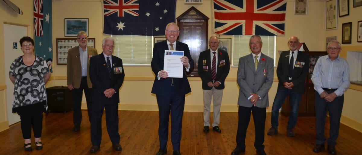 GRANT: Kiama MP Gareth Ward (centre) presented $5400 to the Gerringong RSL Sub-Branch for the publication of a book to mark the centenary of the Geringong RSL Hall (from left) author Robyn Florance, RSL secretary Jeff McClenaughan, president Mike O'Leary, treasurer Wes Hindmarsh, assistant treasurer Alan Lloyd, vice-president Kim Bailey and former secretary Bill Popple.