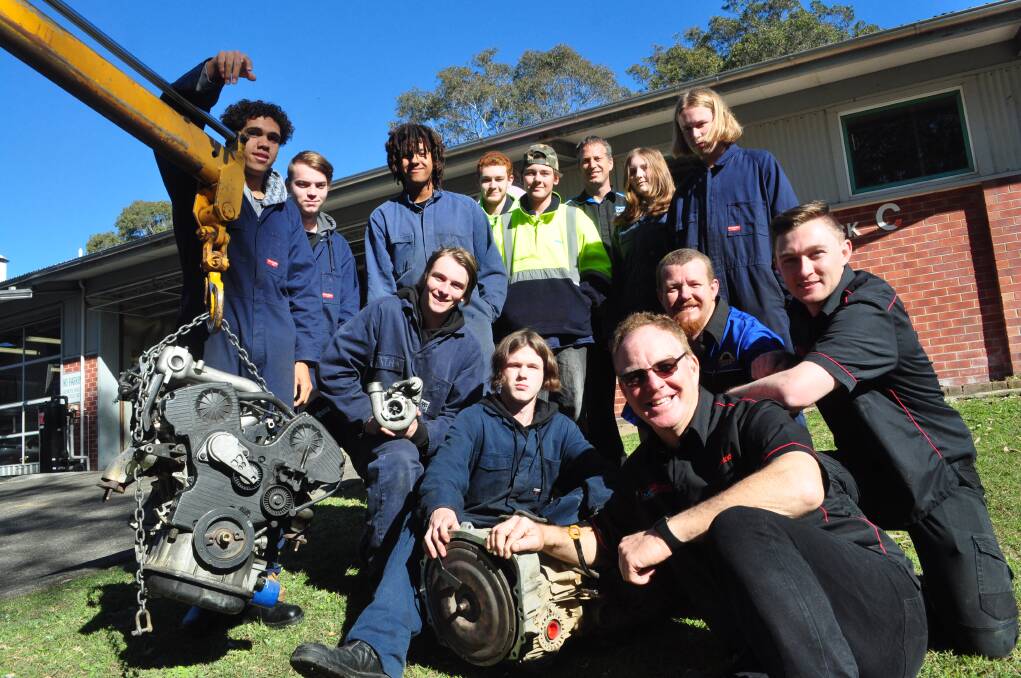 Allan Byrne (Mobile Farm Service) and MotAtec directors Greg Lynch and James Clarke with TAFE NSW Nowra TVET students Saphyre Bunyan, Kuyan Wellington, Dre Howlett, Locky Weekhout, Ethen Robertson, Dawson Hollands, Blake Elson, Jesse Bell and Robert Leighton and automotive head teacher Nathan Malmborg and the donated engine and parts.