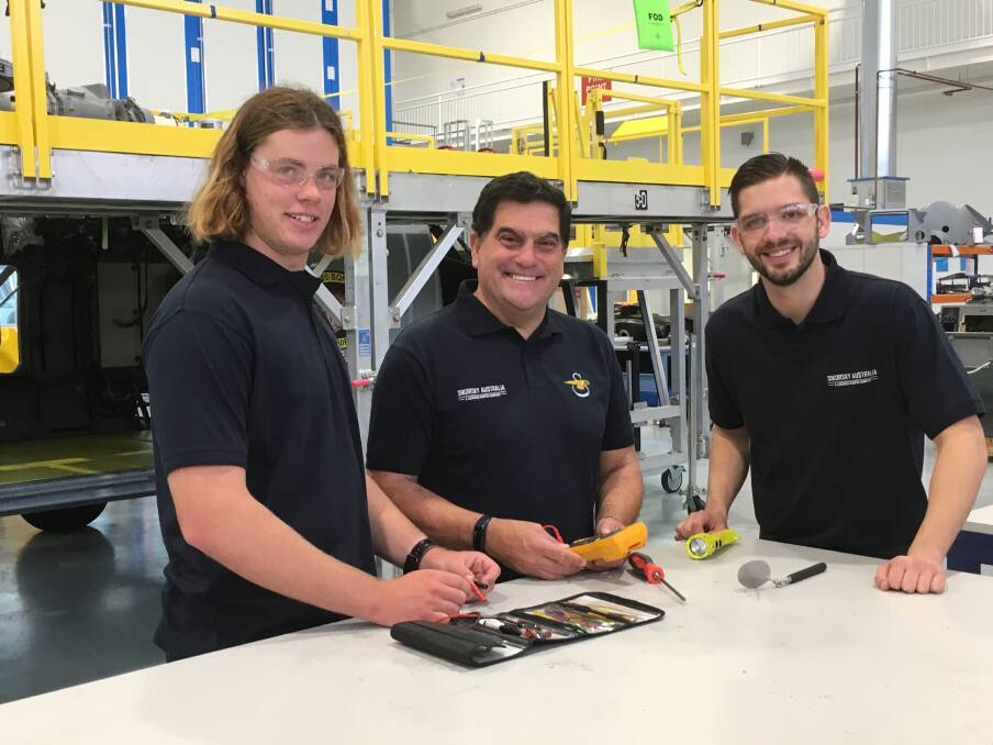 Lockheed Martin Australia chief executive Vince Di Pietro (centre) with new apprentices at the Nowra operation Matthew Lawrence (left) and Sean McAleer.