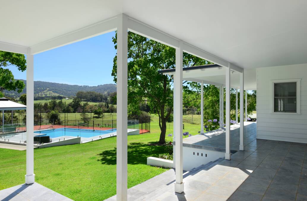 The wrap around veranda provides superb views of the pool and the green hills. Photo: Supplied
