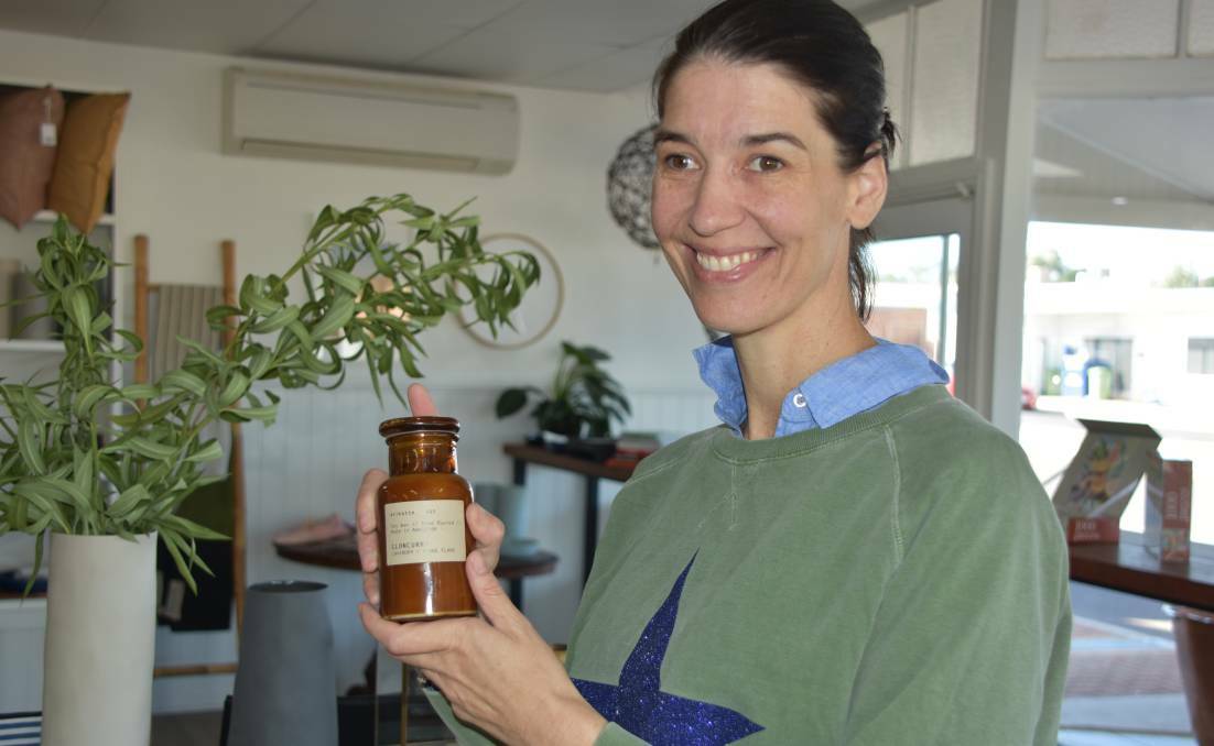 Jen Daniels shows the Cloncurry candle that as been popular with locals. Photo: Samantha Campbell.