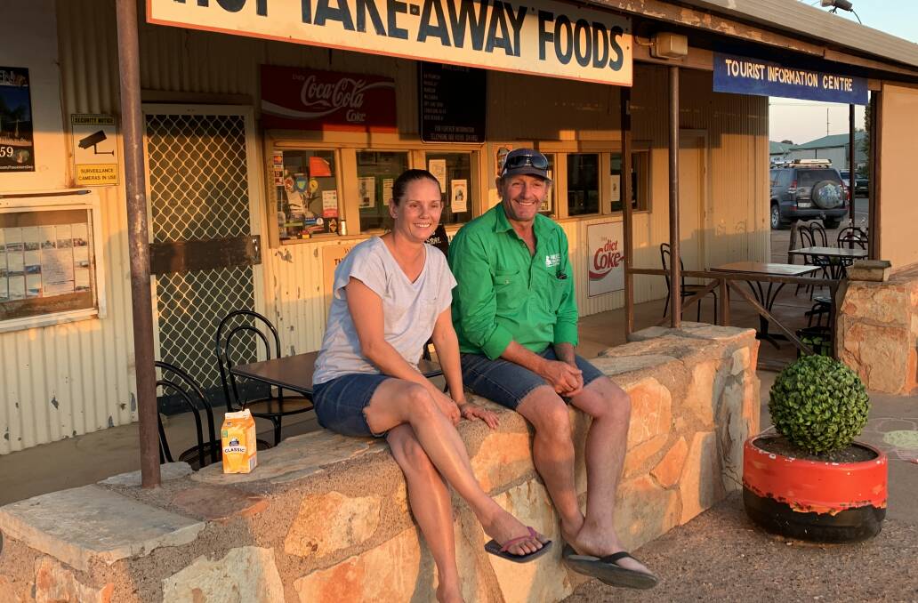 Honor Taylor of the General Store and Rob Dyson of White Cliffs Bus Tours enjoy a quiet moment. Picture: Tim the Yowie Man