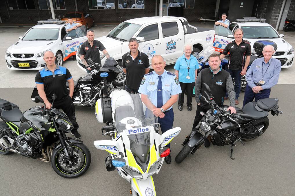 LET'S RIDE: Lake Illawarra's Commander Zoran Dzevlan (centre) and Inspector Paul Allman (fourth from left) with sponsors and organisers of this year's riding contingent. Picture: Adam Mclean