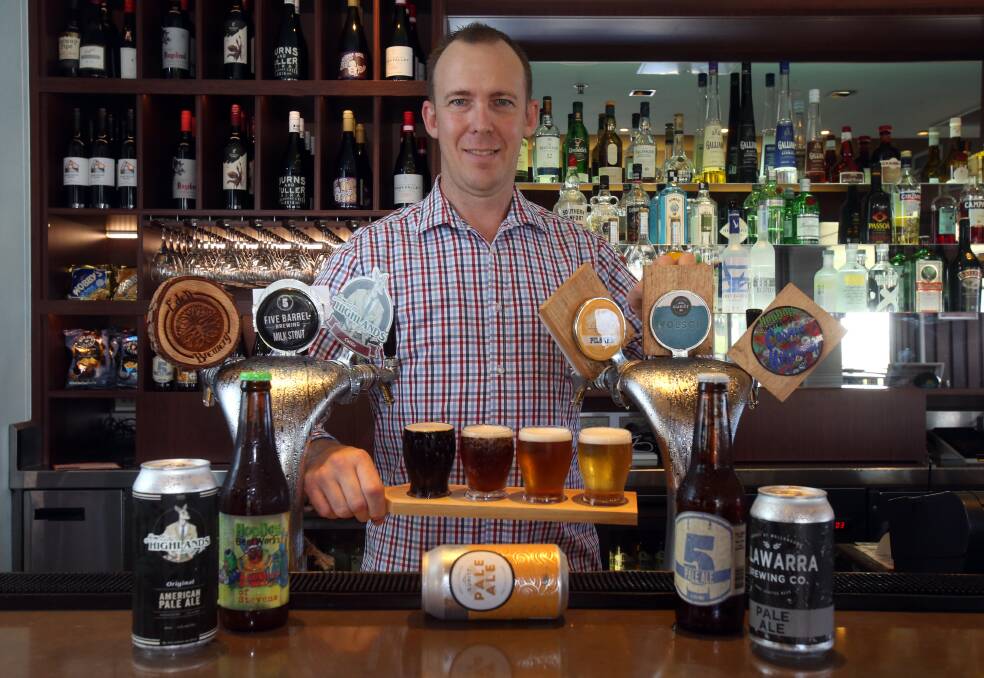 Cheers: Sebel Harbourside Kiama's executive chef and beverage manager Dan James with the local beers now on tap at the hotel. Picture: Robert Peet