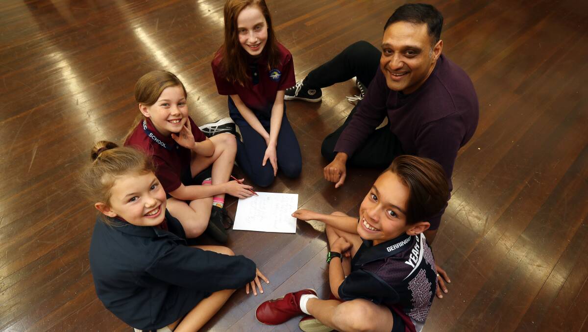 IN TUNE: Gerringong Public School students Emerson Hall, Gabby McKenzie, Chloe Pickens and Sam Le with Song Playground coordinator Dr Sumant Badami