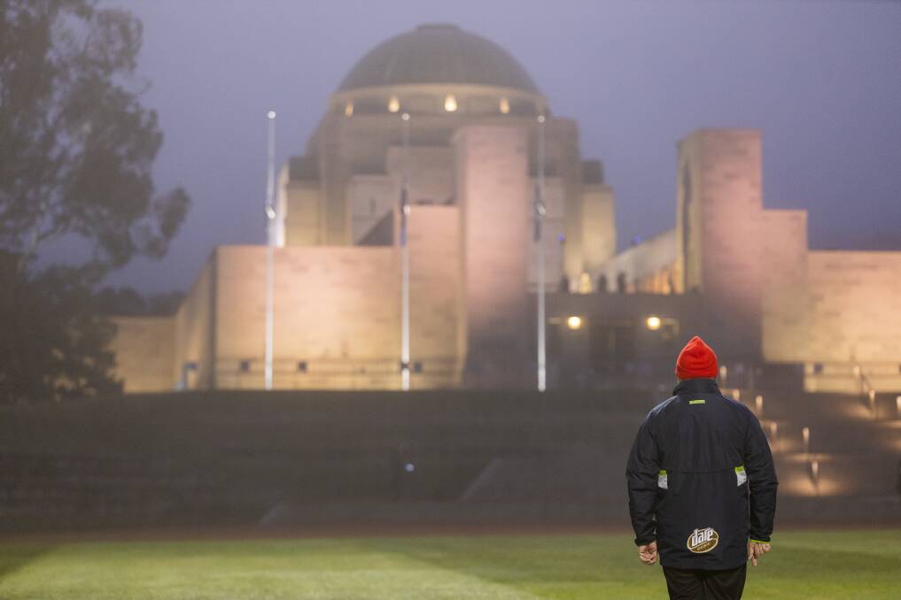 A man silently observing the Anzac Day dawn service at the Australian War Memorial. Picture: Sitthixay Ditthavong