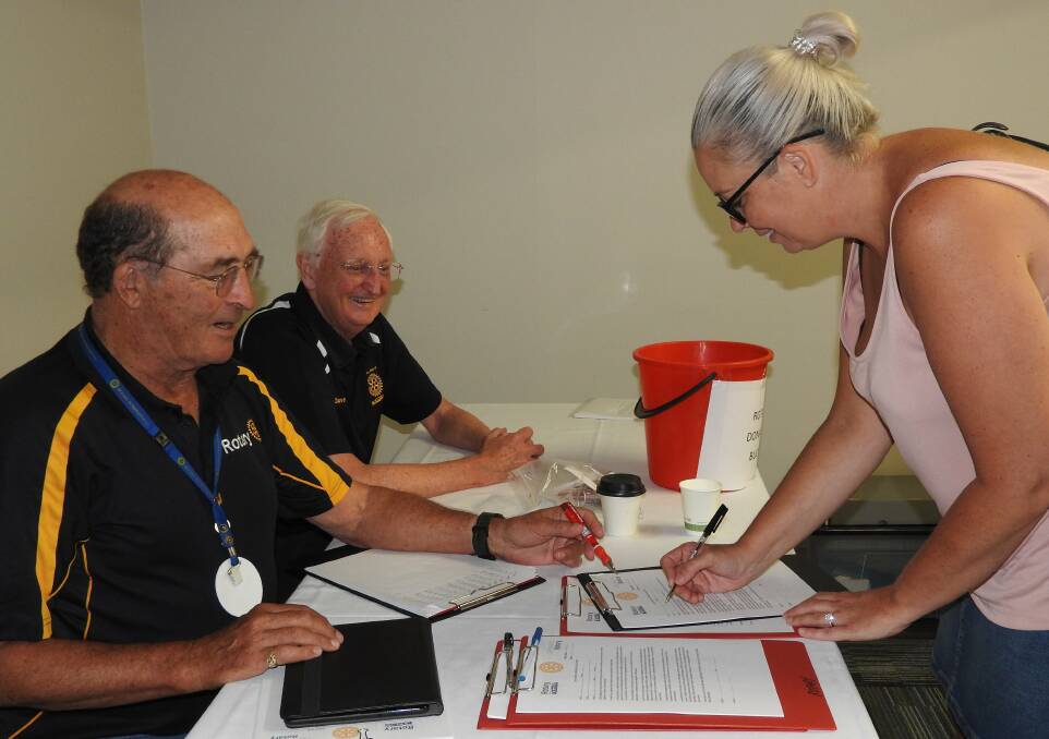 Kelly Clarke signs up for a skin cancer examination as part of the "Free" Skin Cancer Clinic project.