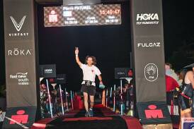 Pierre Paturel celebrates after finishing the Ironman 70.3 Port Macquarie on May 5, 2024. Picture by @NorthSouth 