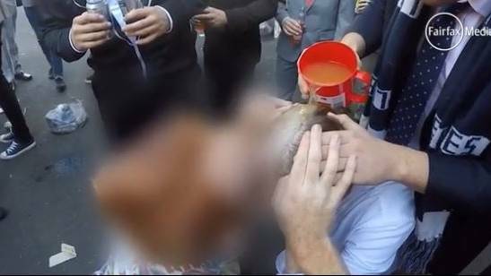Graphic video shows University of Newcastle students drinking alcohol of genitals, participating in hazings of new college residents. The video was released ahead of the Red Zone report.