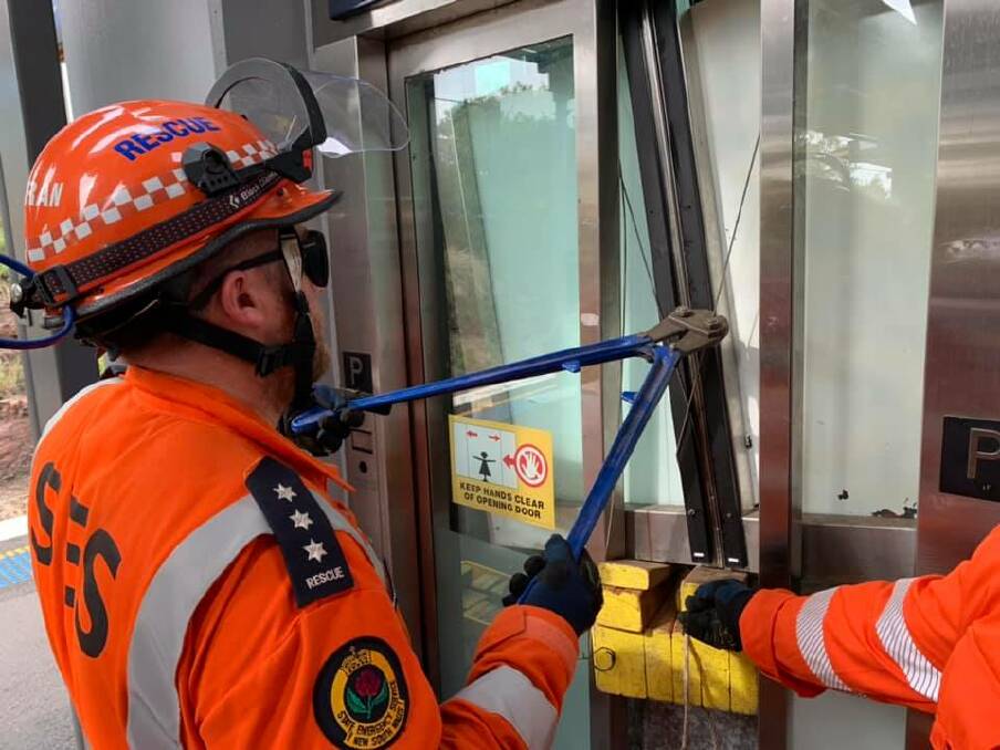 Volunteers work to rescue two peopel trapped in an elevator at Kiama Railway Station.