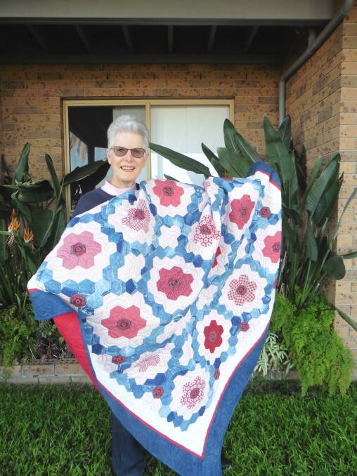 Barbara Mathie of Foxground was the lucky winner of this year's
Jeans for Genes denim quilt. She was thrilled to win this quilt designed and
made by Kiama Quilters' Guild and donated to CMRI Gerringong Committee for
the raffle.