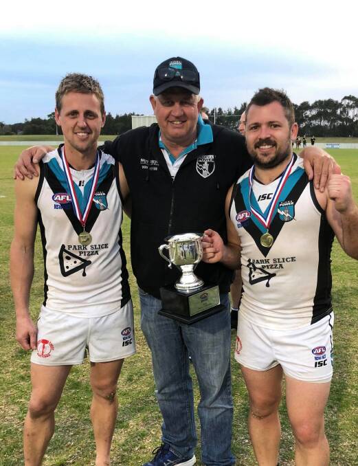Michael Williams (left) with father and former Kiama AFL Club president Darren Williams (centre) and current president Ricky Neels (right).