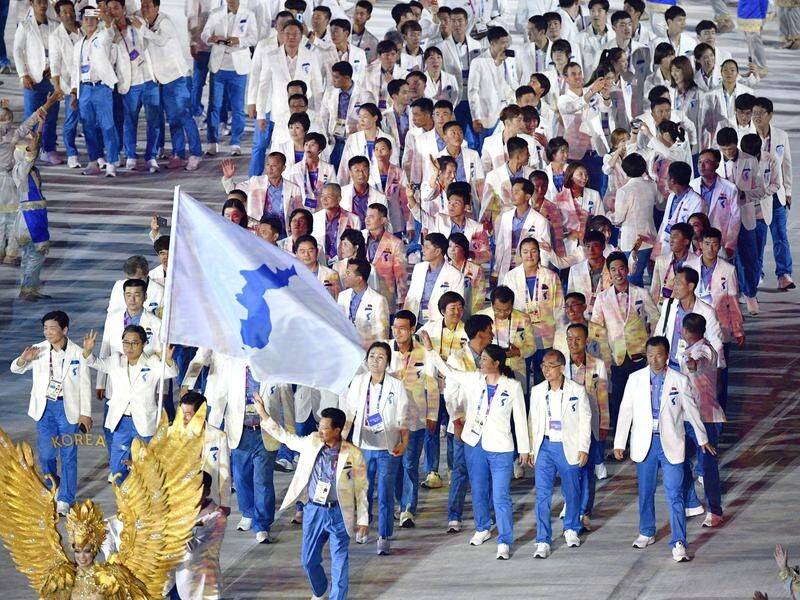Athletes of North and South Korea enter the stadium at the Asian Games opening ceremony.