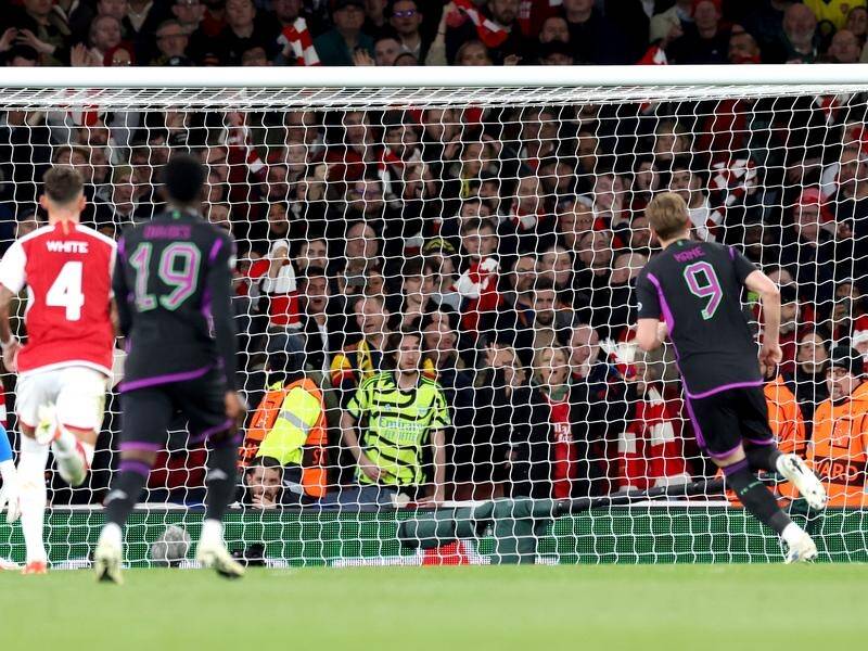 Harry Kane (9) scores for Bayern Munich against Arsenal in the first leg of their European tie. (EPA PHOTO)