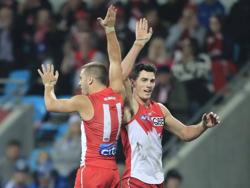 Tom Papley (L) has booted four goals in Sydney's much-needed five-point AFL win over North Melbourne