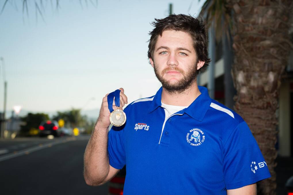 Shell Cove cricketer Mitchell Phelps proudly shows off the Benaud Medal he won as Player of the Match in the recent Sydney first grade competition. Picture: ALBEY BOND