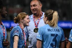 Courtnee Vine (left), coach Ante Juric and Charlotte Mclean celebrate Sydney's 2023 title. (James Gourley/AAP PHOTOS)
