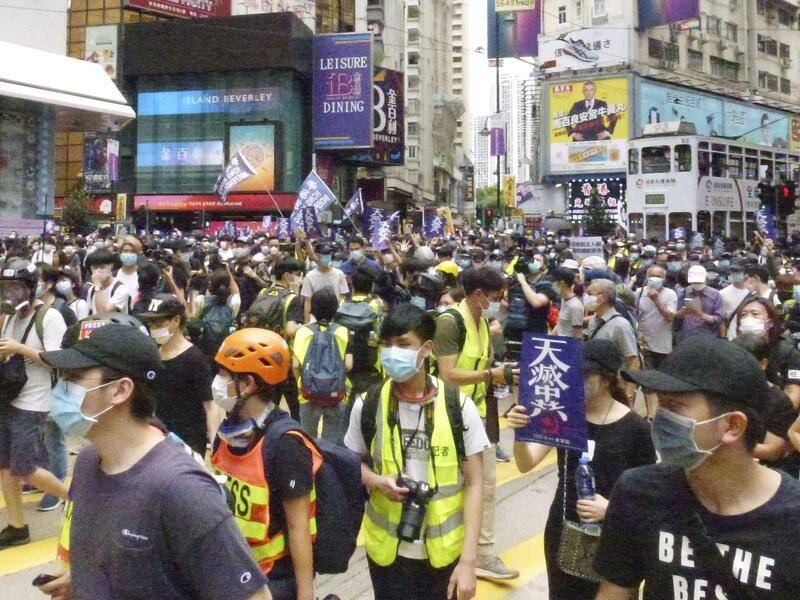 Crowds thronged Hong Kong's streets on Sunday in defiance of coronavirus curbs.