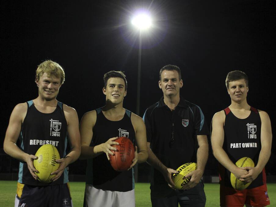 Kiama Power's Michael King, Josh Simpson, first grade coach James Walton and Jack Bateman at training under the new Bonaira Street lights, which will be used within game conditions on Saturday night. Picture: DAVID HALL