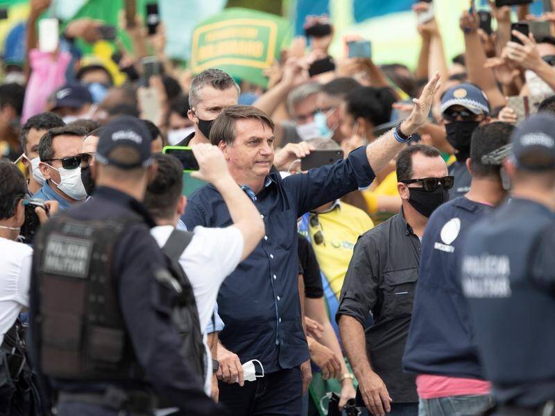 Brazilian President Jair Bolsonaro has met demonstators in Brasilia.