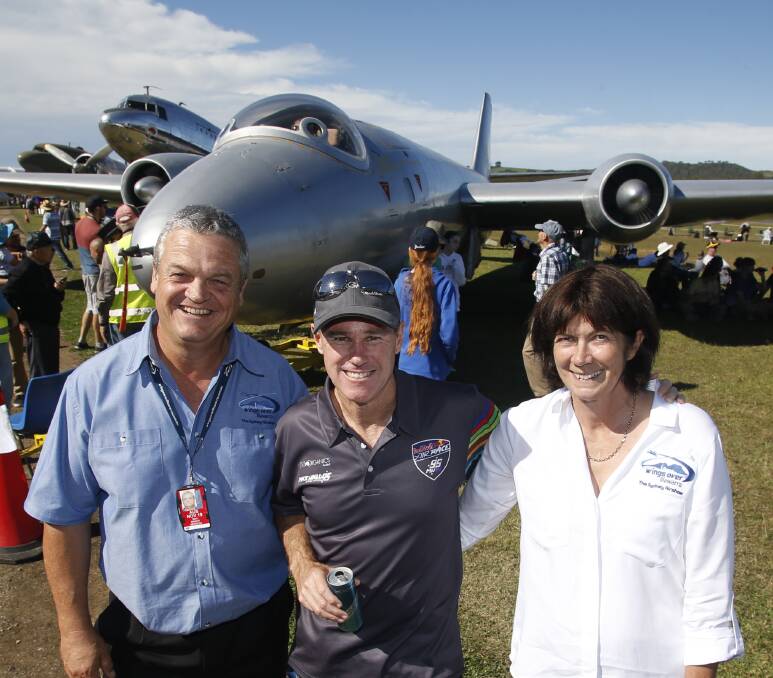 Wings Over Illawarra: Mark and Kerry Bright with Red Bull air racer Matt Hall (centre) who loves the Illawarra air show so much he has been six times. Picture: Anna Warr.