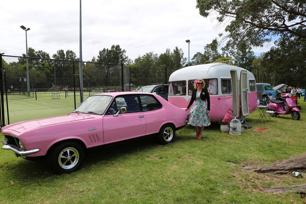Pretty in pink: Monica Squires with her 1972 GTR XU1 Torana, 1960 Sunliner caravan and Vespa camping set-up. Picture: Greg Ellis. 
