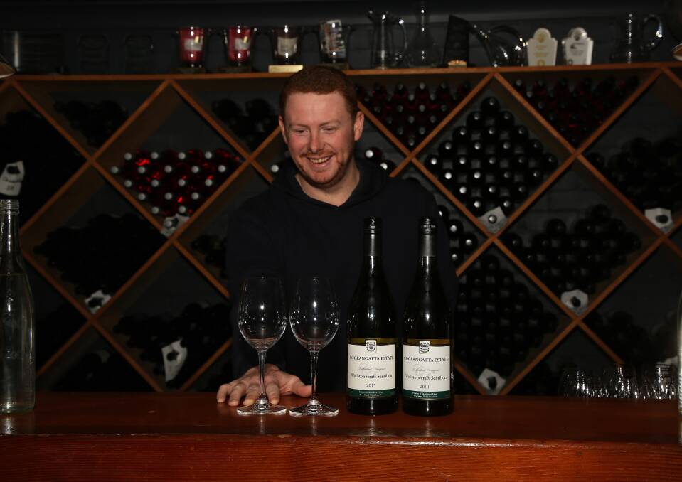 Best in Australia: Coolangatta Estate cellar door manager Ben Bishop with the two semillons that took first and second place in their category at the Six Nations Wine Challenge.

