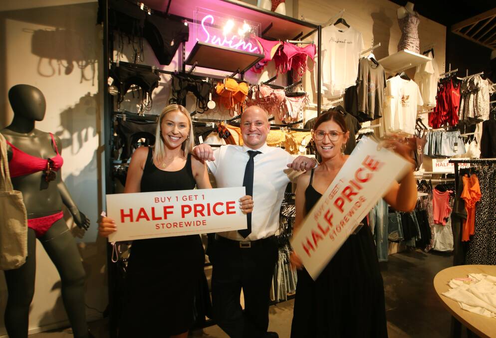 Boxing Day Boom: Lauren Clapham and Kate Fonseca at Edge celebrate the bumper Christmas trade with Stockland Shellharbour centre manager Daniel Buchanan. Picture: Sylvia Liber.
